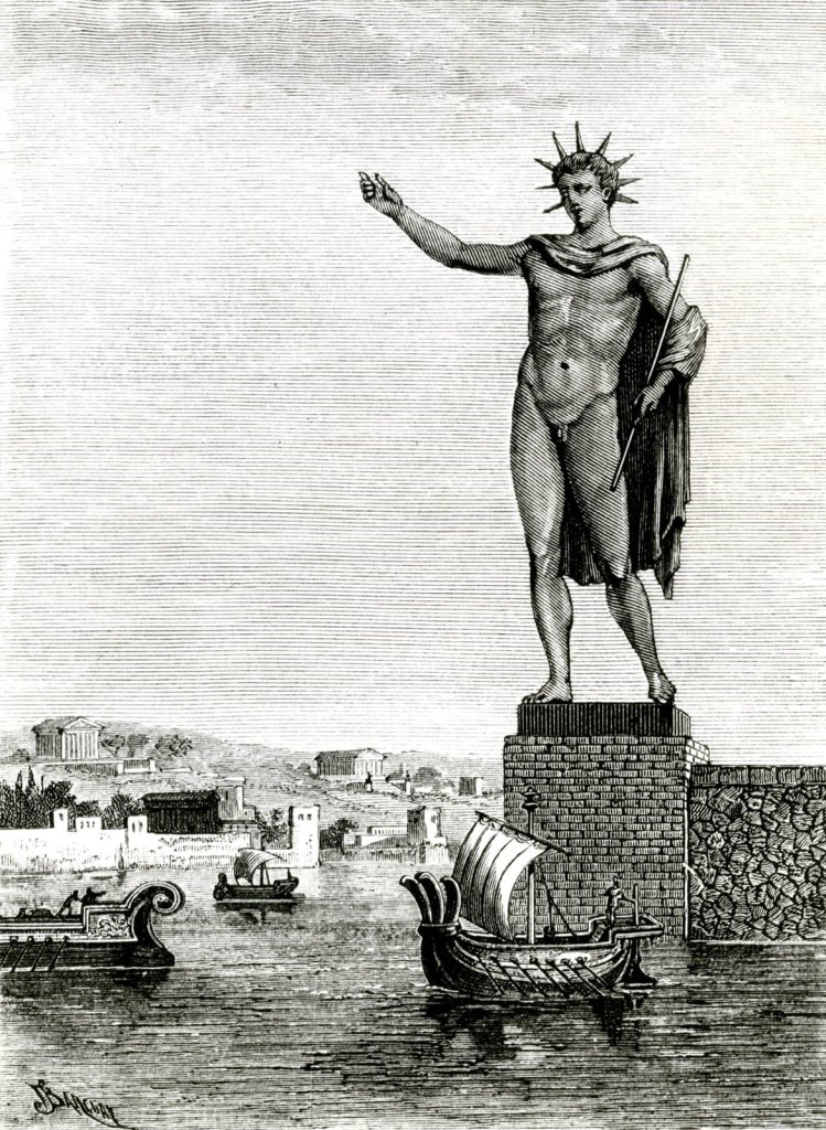 Socha byla vztyčena u rhodského přístavu. Zdroj obrázku: ravure sur bois de Sidney Barclay numérisée Google, Public domain, via Wikimedia Commons