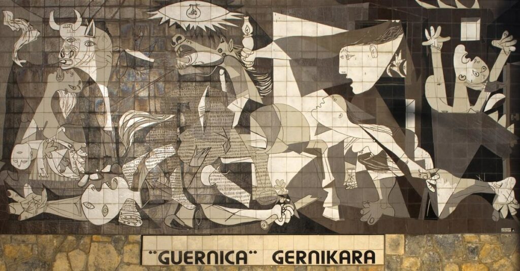 Malba na zdi inspirovaná Guernicou Foto: Papamanila / CC BY-SA 3.0
